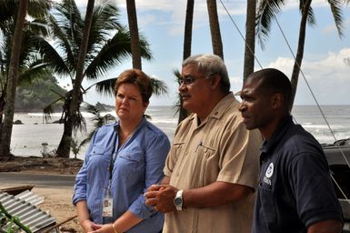 Earthquake ^ Flooding ^ Tsunami - Amanave, American Samoa, November 13, 2009 -- Nancy Ward, administrator of FEMA Region IX, and Kenneth R. Tingman, FEMA's federal coordinating officer in American Samoa, listen as Tusi Suiaunoa, chief protocol officer for the governor's office, describes the damage and recovery in the village of Amanave. Many homes in Amanave were destroyed by the tsunami of September 29, 2009, but no lives were lost there. Elsewhere in American Samoa there were 32 confirmed deaths as of this date. Richard O'Reilly/FEMA.