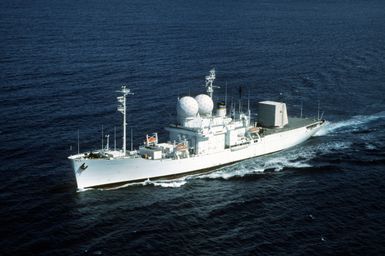 An aerial port bow view of the missile range instrumentation ship USNS OBSERVATION ISLAND (T-AGM 23) underway off the coast Hawaii