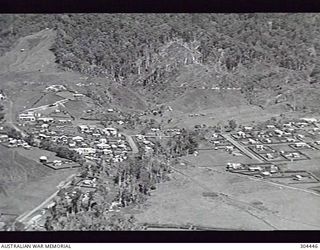 WAU, NEW GUINEA. AERIAL VIEW OF THE TOWN PRIOR TO WORLD WAR 2. (NAVAL HISTORICAL COLLECTION)