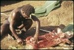 Saelasi, butchering a pig