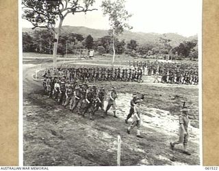 POM POM VALLEY, NEW GUINEA. 1943-11-30. 2/12TH AUSTRALIAN INFANTRY BATTALION, MARCHING OFF THE SPORTSGROUND AFTER AN INSPECTION BY THEIR COMMANDING OFFICER, QX6008 LIEUTENANT COLONEL C. C. BOURNE. ..