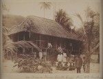 Missionary with indigenous men and teachers outside mission house, Papua New Guinea, ca. 1890