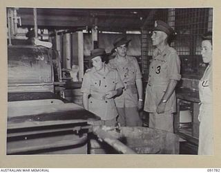 LAE, NEW GUINEA. 1945-05-14. LIEUTENANT GENERAL V.A.H. STURDEE, GENERAL OFFICER COMMANDING FIRST ARMY (3), ACCOMPANIED BY LIEUTENANT COLONEL M.J. SPENCER, ASSISTANT CONTROLLER AUSTRALIAN WOMEN'S ..