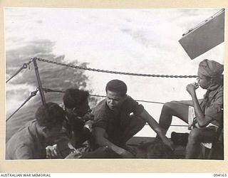 TINIAN, BOUGAINVILLE. 1945-07-18. NETHERLANDS EAST INDIES ARMY PERSONNEL EATING ABOARD THE MOTOR LAUNCH ML1327. THE VESSEL IS BEING USED BY THE ALLIED INTELLIGENCE BUREAU TO MOVE TO TOROKINA, ..