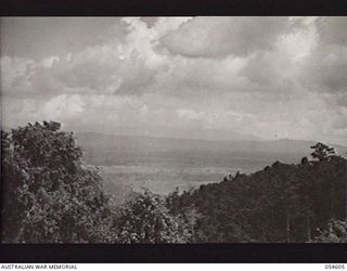 MILNE BAY, NEW GUINEA, 1943-07-11. OVERLOOKING GURNEY'S STRIP. THIS RAAF AERODROME WAS NAMED AFTER SQUADRON LEADER GURNEY