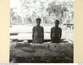 NADZAB, NEW GUINEA. 1944-09-02. TWO OF THE NEW GUINEA NATIVES EMPLOYED AT THE SAWMILL OF THE NEW GUINEA FORCE SCHOOL OF SIGNALS