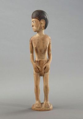 Young male carved figure