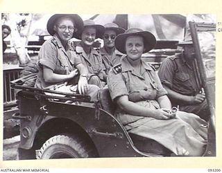 BOUGAINVILLE, 1945-06-18. NURSING SISTERS OF 109 CASUALTY CLEARING STATION, IN A JEEP AT HQ 3 DIVISION, AFTER THEIR VISIT TO THE ADVANCED DRESSING STATION SOUTH OF DAWE CREEK, SOUTH BOUGAINVILLE. ..