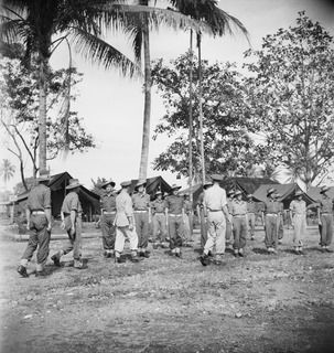 LAE, NEW GUINEA. 1944-08-28. VX13 LIEUTENANT GENERAL S.G. SAVIGE, CB, CBE, DSO, MC, ED, GENERAL OFFICER, NEW GUINEA FORCE (4) INSPECTING MEMBERS OF NO. 20 PLATOON, "F" COMPANY, 2/1ST GUARD REGIMENT ..