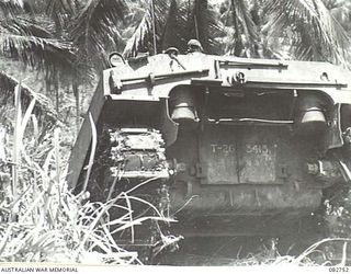 MADANG, NEW GUINEA. 1944-10. A SHERMAN M4A2 MEDIUM TANK (REAR VIEW) AT THE TOP OF COURSE NO. 2 DURING TANK TESTS AT HQ 4 ARMOURED BRIGADE