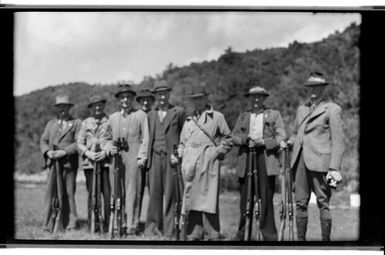 Group of men holding rifles