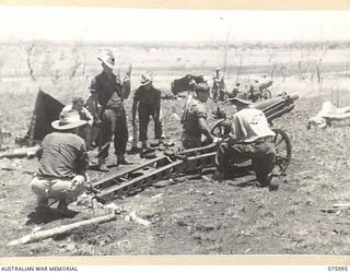 NADZAB AREA, NEW GUINEA. 1944-09-15. PERSONNEL OF THE 2ND MOUNTAIN BATTERY (75MM) PREPARING TO FIRE DURING A PRACTICE SHOOT. IDENTIFIED PERSONNEL ARE: SERGEANT CRANSTON (1); TROOPER A.S. DAWSON ..