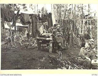 WAREO, PAPUA, NEW GUINEA, 1944-03-29. PATIENTS AT THE LOOKOUT POINT AT B COMPANY, 4TH FIELD AMBULANCE REST CAMP. IDENTIFIED PERSONNEL ARE: V30567 DRIVER R.L. THOMPSON, 4TH FIELD AMBULANCE (1); ..