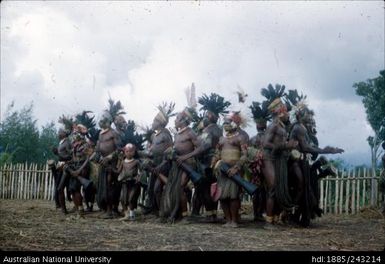 Dancing group, holding drums