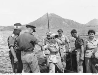 RABAUL, NEW BRITAIN. 1945-10-26. MEMBERS OF AUSTRALIAN ARMY MEDICAL WOMEN'S SERVICE ARRIVING AT THE WHARF. CAPTAIN H.C. WITT WHO IS IN CHARGE OF THE AUSTRALIAN ARMY MEDICAL WOMEN'S SERVICE IS SHOWN ..