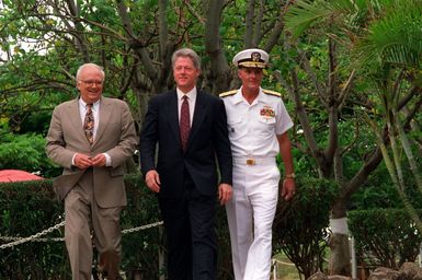 President William Jefferson Clinton arrives at Admiral's Landing along with Secretary of Defense Les Aspin, left, and Adm. Charles R. Larson, commander-in-chief, U.S. Pacific Fleet, right, as the three prepare to visit the ARIZONA (BB-39) Memorial. The men are in Hawaii to tour area military installations