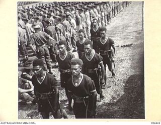 CAPE WOM, NEW GUINEA, 1945-09-13. A DETACHMENT OF THE ROYAL PAPUAN CONSTABULARY TAKING UP THEIR POSITIONS ON PARADE FOR THE SURRENDER CEREMONY HELD AT CAPE WOM AIRSTRIP WHERE LIEUTENANT-GENERAL H. ..