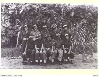Group portrait of the personnel of 6 Port Detachment, 30 Advanced Supply Depot, Australian Army Service Corps. Left to right, back row: SX30455 R W W Nutt; NX163359 Driver (Dvr) R A Tiddy; NX123039 ..