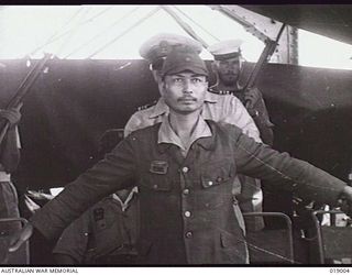 Bougainville. August 1945. Japanese interpreter Mr Takahashi who accompanied the envoy, Captain Takenaka, aboard HMAS Lithgow during the Japanese surrender, is seen here being searched to make sure ..