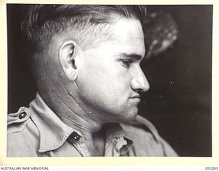 TOROKINA, BOUGAINVILLE, 1945-06-21. TREATMENT OF MALOCCLUSION AT HQ 4 BASE SUB AREA BY DENTAL OFFICER, MAJ A.G. ROWELL. PROFILE VIEW OF PATIENT, DVR R. MCCLURE SHOWING ABNORMALLY CLOSED BITE WITH ..