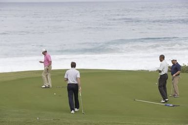 Barack Obama plays golf with Prime Minister Najib Razak, Joe Paulsen, and Mike Brush in Kaneohe Bay, Hawaii, December 24, 2014