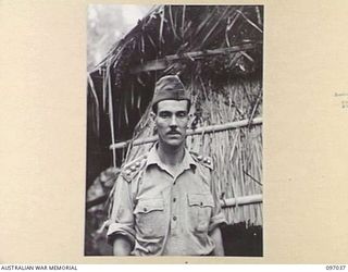 KURURAI YAMA, NEW BRITAIN. 1945-09-17. CAPTAIN MUNROE, THE ONLY ENGLISH OFFICER IN THE INDIAN REGIMENT AT THE INDIAN PRISONER OF WAR CAMP. HE WAS SENTENCED TO DEATH THREE TIMES BY THE JAPANESE AND ..