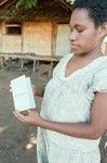 Woman holding Vanuatu Electoral and Identity Card