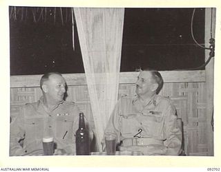 LAE AREA, NEW GUINEA. 1945-06-02. LIEUTENANT COLONEL J.H. JONES, COMMANDING OFFICER HEADQUARTERS ANGAU NORTHERN REGION (1) AND MAJOR GENERAL B.M. MORRIS, GENERAL OFFICER COMMANDING ANGAU (2), ..