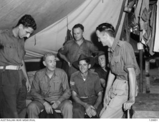 RABAUL, NEW BRITAIN. 1945-12-28. THE PRIME MINISTER OF AUSTRALIA, MR BEN CHIFLEY, ARRIVED BY PLANE TO VISIT MANY OF THE UNITS IN THE AREA. MR CHIFLEY VISITED THE CAMP LINES OF THE 16TH BATTALION ..