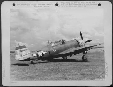 Air Force Pilot In The Cockpit Of The Republic P-47 Thunderbolt 'Miss Mary'. Note Rocket Guns Attached To The Wing. Saipan, Marianas Islands, 9 July 1944. (U.S. Air Force Number 63724AC)