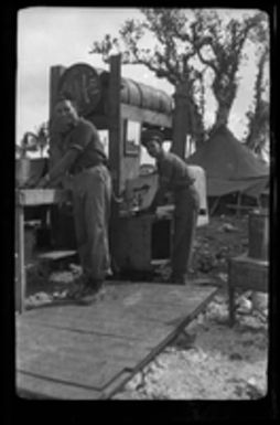 [Elmer A. Ball and other serviceman washing up at outdoor sinks]