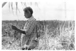 Malakai "Japper" on Tongan "graves" at Moana-i-Ra, Nukunuku (village on skyline behind shoulder)