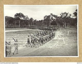 POM POM VALLEY, NEW GUINEA. 1943-11-30. 2/12TH AUSTRALIAN INFANTRY BATTALION, MARCHING PAST IN "COLUMN OF ROUTE". IDENTIFIED PERSONNEL ARE: SERGEANT B. JURY (1); PRIVATE A. M. JOHNSTON MM. (2); ..