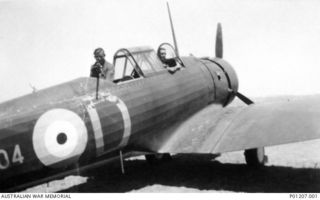 FAIRBAIRN, ACT, 1942. CAC WIRRAWAY (SERIAL NO. A20-104) ON THE GROUND AT RAAF BASE FAIRBAIRN IN EARLY 1942. IN THE REAR COCKPIT, MANNING THE VICKERS GO GUN, IS RAAF FITTER IIE LEN TAYLOR; ANOTHER ..