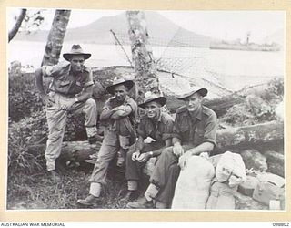 RABAUL, NEW BRITAIN. 1945-11-13. PERSONNEL OF 11 DIVISION, ROYAL AUSTRALIAN ENGINEERS, ABOUT TO EMBARK ON THE MANGOLA DURING THE DEPARTURE OF THE FIRST HIGH PRIORITY PERSONNEL UNDER THE ..