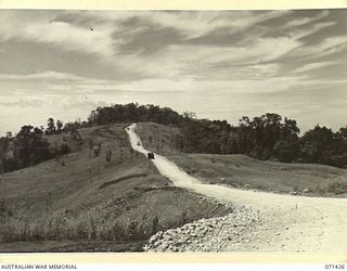 PINO HILL, FINSCHHAFEN AREA, NEW GUINEA. 1944-03-21. PINO HILL LOOKING NORTH FROM NORTH HILL. THE AREA IS WITHIN HEADQUARTERS, 2ND AUSTRALIAN CORPS