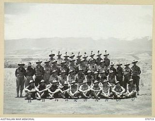 DALLMAN RIVER, NEW GUINEA. 1944-02-23. THE COMMANDING OFFICER WITH OFFICERS OF THE 2/14TH FIELD REGIMENT. IDENTIFIED PERSONNEL ARE: SX10841 LIEUTENANT L.K. BROMLEY (1); NX3222 LIEUTENANT J.A. ..