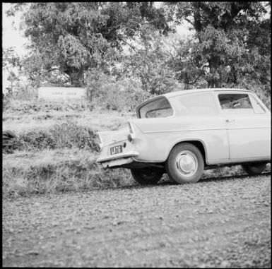 Car parked near the tomb of Fijian chief and cannibal Udre Udre, Rakiraki, Fiji, 1966 / Michael Terry