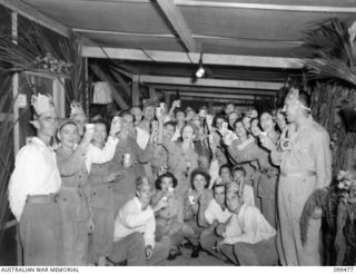 Patients and staff of 118th Australian General Hospital enjoy themselves at their Christmas party. Identified are: VX86318 Private Lester George Berick , 2/3rd Australian Convalescent Depot (ACD), ..