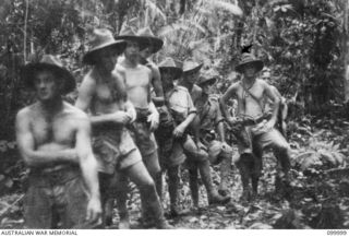 BULWA, BULOLO VALLEY, NEW GUINEA, 1942-05. A SECTION OF C PLATOON, 2/5TH INDEPENDENT COMPANY, ON AN EXERCISE WALK ALONG A JUNGLE TRACK, WEST OF BULWA IN THE BULOLO VALLEY