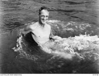 1943-09-20. NEW GUINEA. BUSO RIVER - LAE AREA. SAPPER ALAN SKEELES OF SALE, VICTORIA HAS A DIP IN THE BUSO RIVER. (NEGATIVE BY H. DICK)