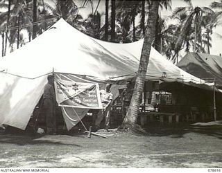 PALMALMAL PLANTATION, NEW BRITAIN. 1945-01-27. THE TENT HEADQUARTERS OF THE YOUNG MEN'S CHRISTIAN ASSOCIATION - AUSTRALIAN COMFORTS FUND UNIT AT THE 5TH BASE SUB AREA