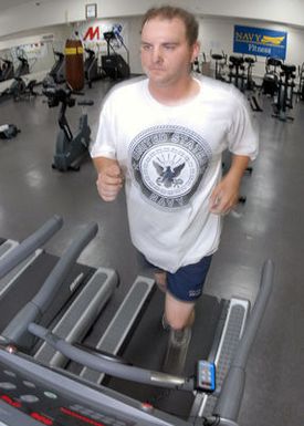 U.S. Navy PETTY Officer 2nd Class Steven Bloem, assigned to Naval Security Force Detachment Guam, runs on a treadmill at Charles King gym located on Naval Base Guam. (U.S. Navy PHOTO by Mass Communication SPECIALIST 2nd Class John F. Looney) (Released)