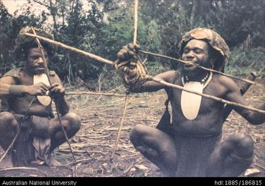 Two men weaving