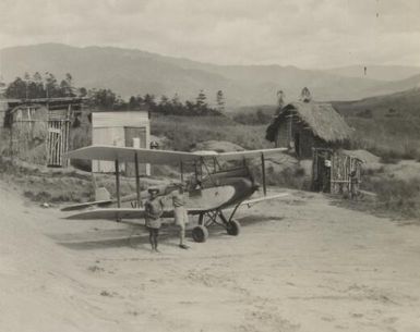 Moth plane on the turntable at Surprise Creek aerodrome Upper Watut River, pilot is Mr. Joe Wilson