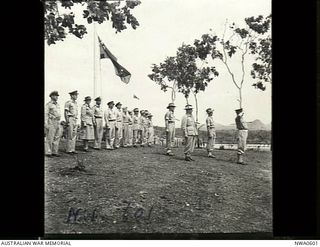 Port Moresby, Papua. 1944-08-05. Major General B. M. Morris DSO, Commander of the Australian - New Guinea Administrative Unit (ANGAU), taking the salute at the march past at the opening of the ..