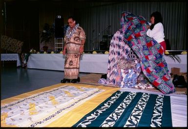 Women decorating chair for guest of honour at Niuean ear-piercing ceremony, Auckland