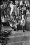 Madang market: women sell garden produce arranged on ground