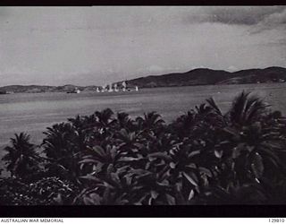 PORT MORESBY, PAPUA. 1942-03-19. VIEW FROM RAAF HEADQUARTERS OF THE BOMBING OF WANAKA BY JAPANESE AIRCRAFT