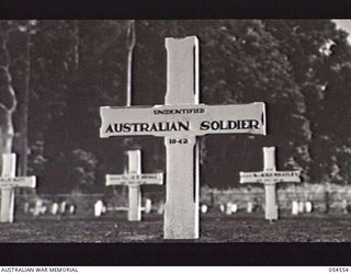 SOPUTA, NEW GUINEA, 1943-07-20. WOODEN CROSSES MARKING THE GRAVES OF UNIDENTIFIED SOLDIERS AT THE SOPUTA WAR CEMETERY